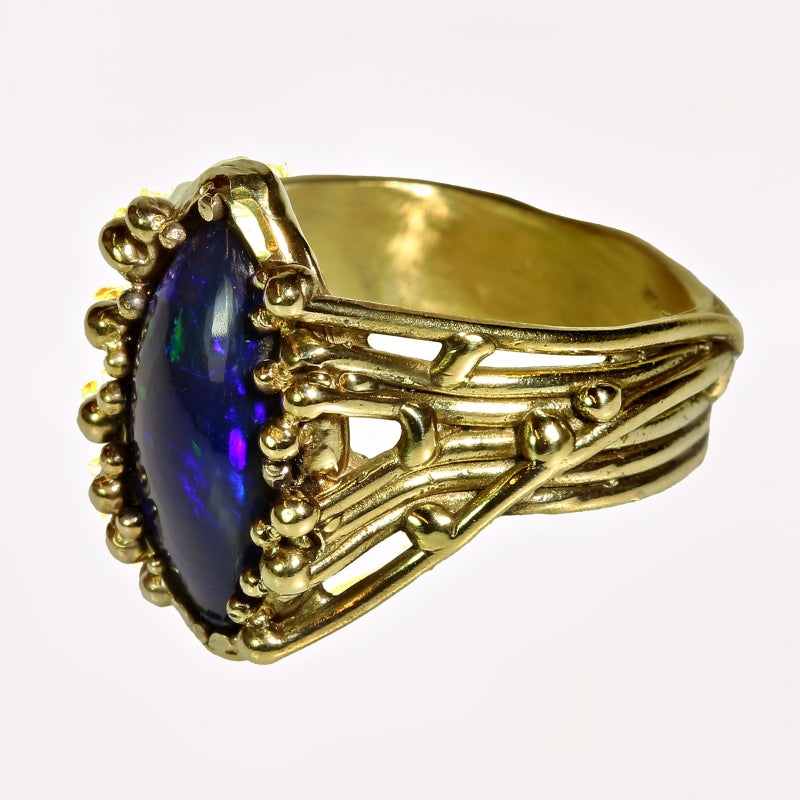Gold ring Galaxy with dark blue opal