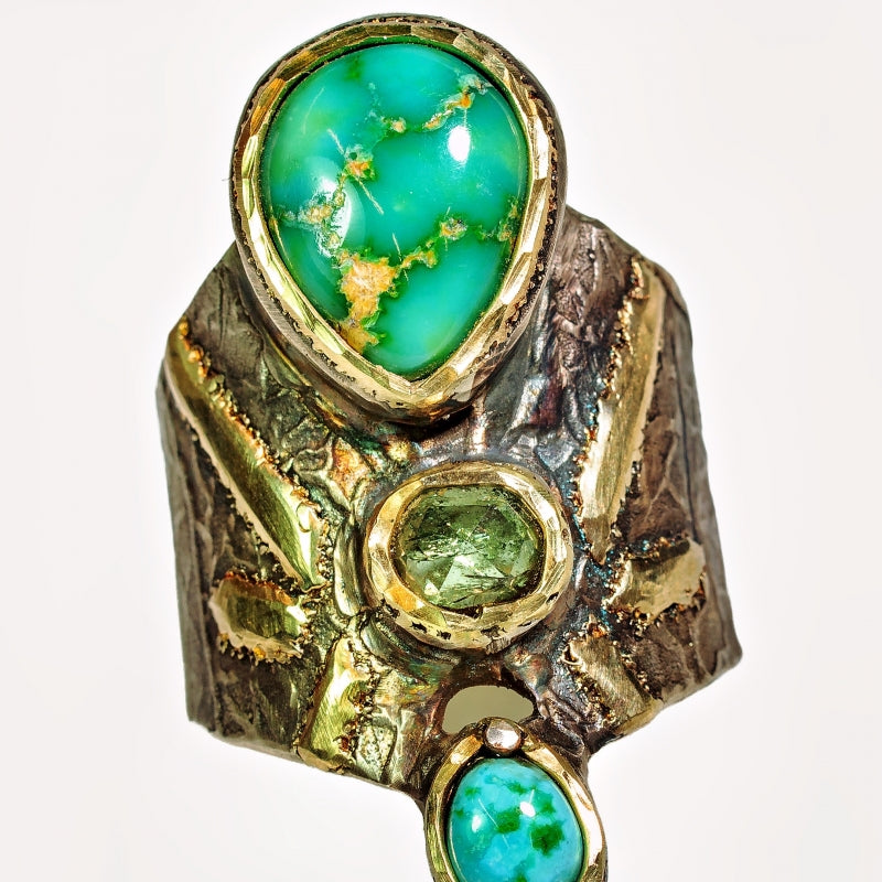 Wide ring with turquoises and sapphire