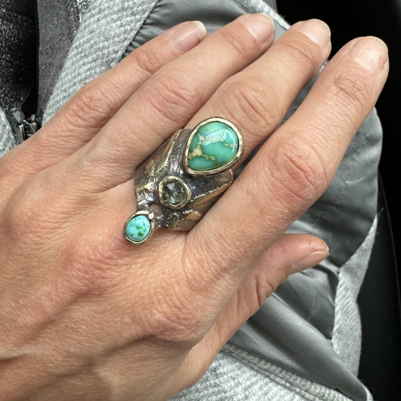 Wide ring with turquoises and sapphire