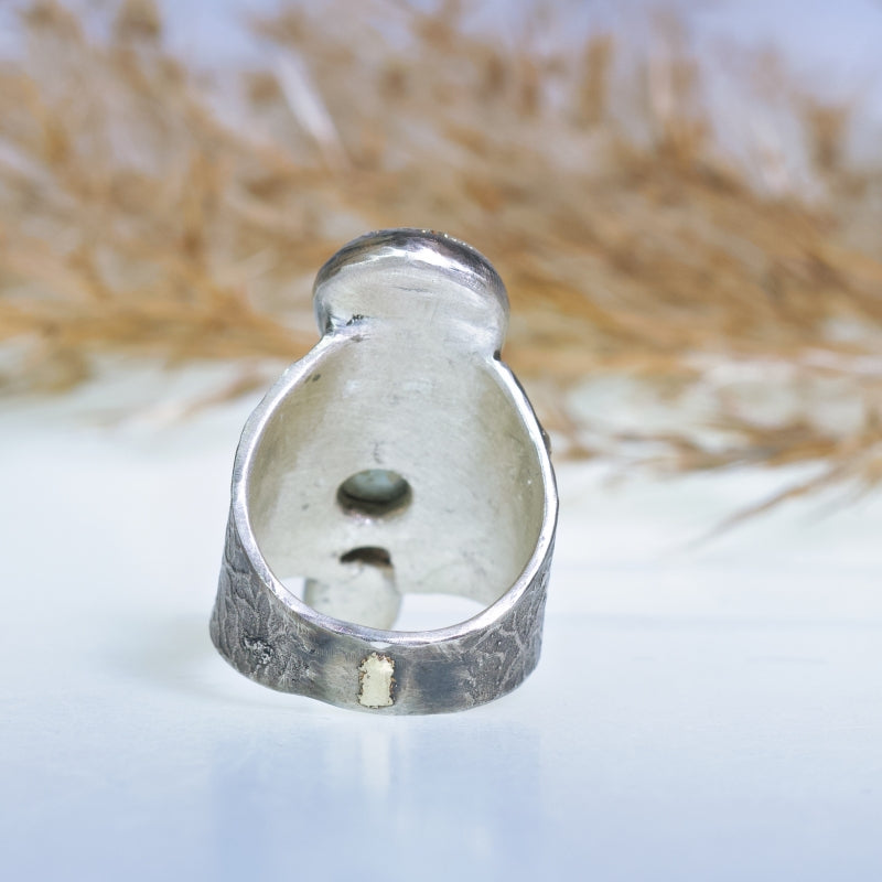 Wide ring with turquoises and sapphire