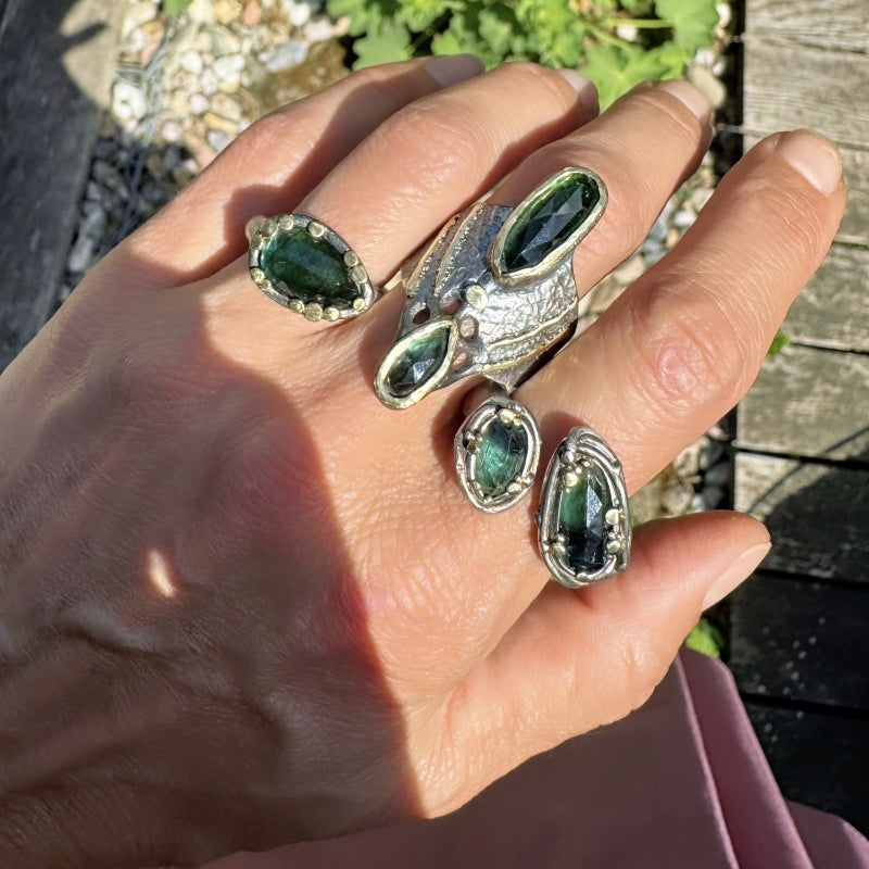 Wide ring with two teal rose cut tourmalines