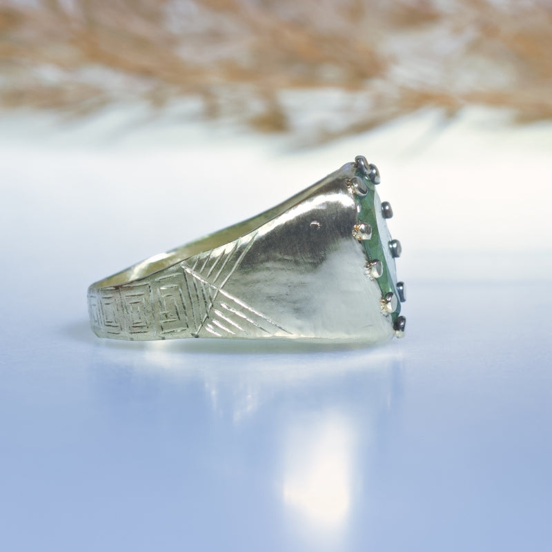 Statement gold ring with big emerald and hand carved band