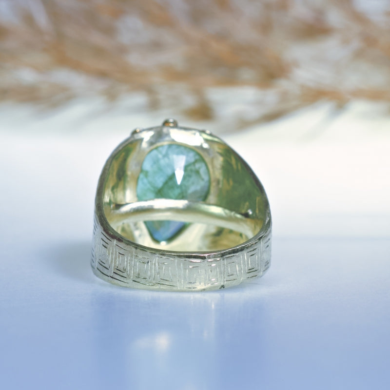 Statement gold ring with big emerald and hand carved band