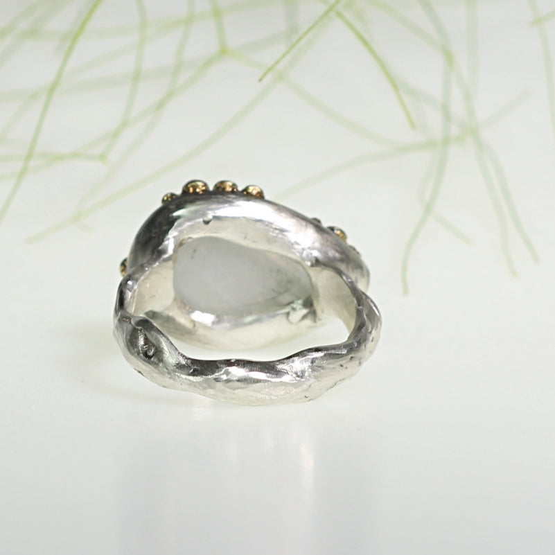 Ring with rainbow moonstone and gold dots