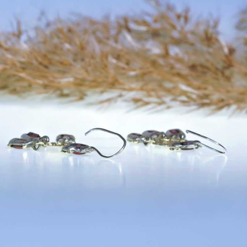 Earrings with pixelated cut garnets